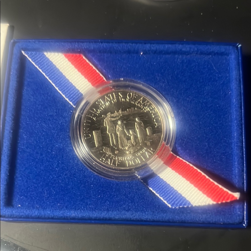 Commemorative Silver Coin with Red, White, and Blue Ribbon